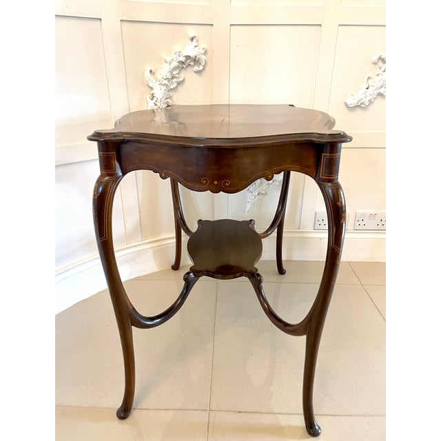 Superb quality antique victorian mahogany inlaid shaped centre table having a mahogany inlaid shaped top with a splendid...