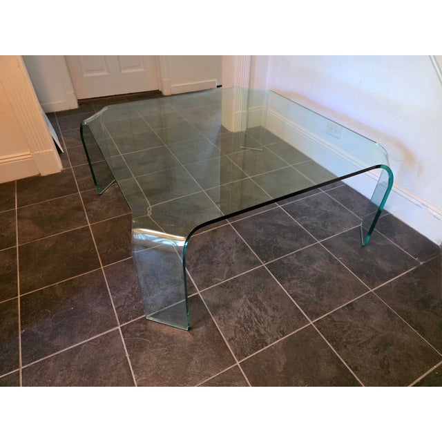 Fabulous 80's post modern coffee table designed by Vittorio Livi for FIAM Italia, Pesaro, Italy. Table is a bent leg...