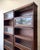 Pair of vintage oak barrister-style display bookcases featuring beautiful leaded glass accents, sliding glass doors, and...