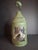 Offered is an exceptional, authentic early 19th-century American punched tin lantern featuring a rare, intact front mica...