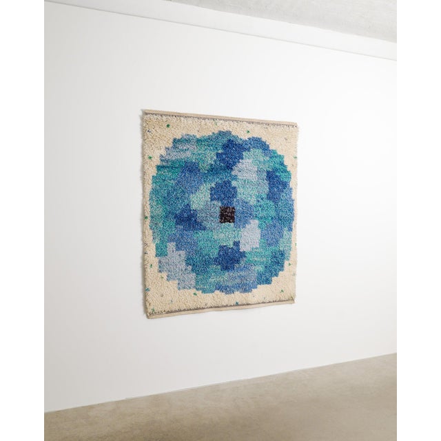 A rare and decorative swedish mid century "rosen blå" wool pile rug in beige, blue and green designed by marianne richter...
