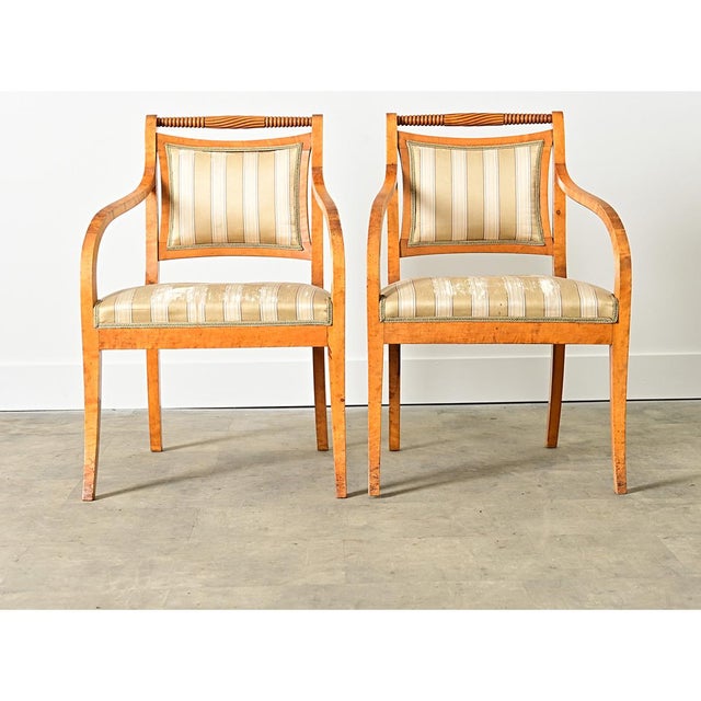 A unique pair of Swedish late 19th century/early 20th century carved birch armchairs, in the Biedermeier style hence the...