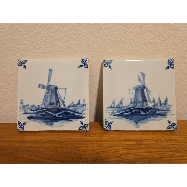 Set of 2, Iconic Delft Blue wall/fireplace tiles with classic Dutch windmill and landscape scenes. Tiles are in used...