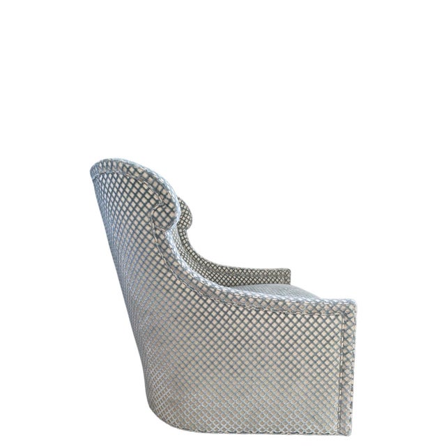 An elegant swivel chair from the Tuileries collection, designed by Jacques Garcia for Baker Furniture. With its graceful...