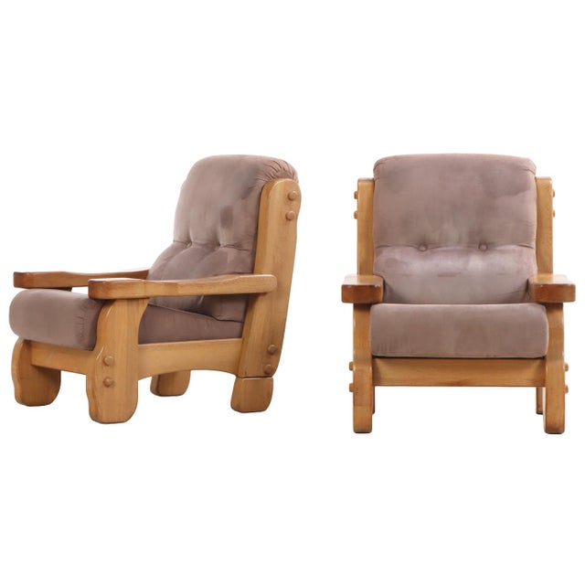 A striking example of mid-century European craftsmanship, this pair of lounge chairs embodies the bold, sculptural...