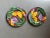 Set of bread or salad plates from Fitz and Floyd. Vibrant multicolored Cloisonne' Tropicana pattern. Features bold floral...