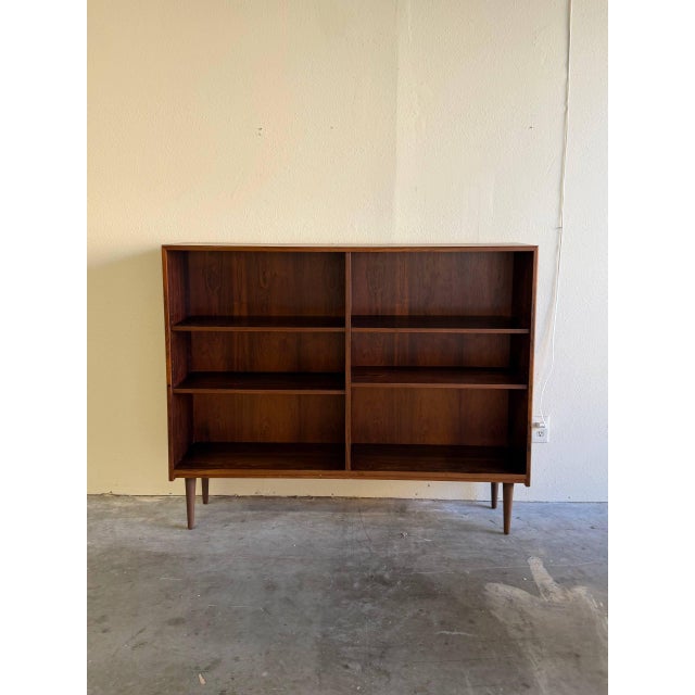 Beautiful vintage Danish Mid-Century Modern bookcase crafted in richly grained rosewood, dating to the 1960s. This piece...