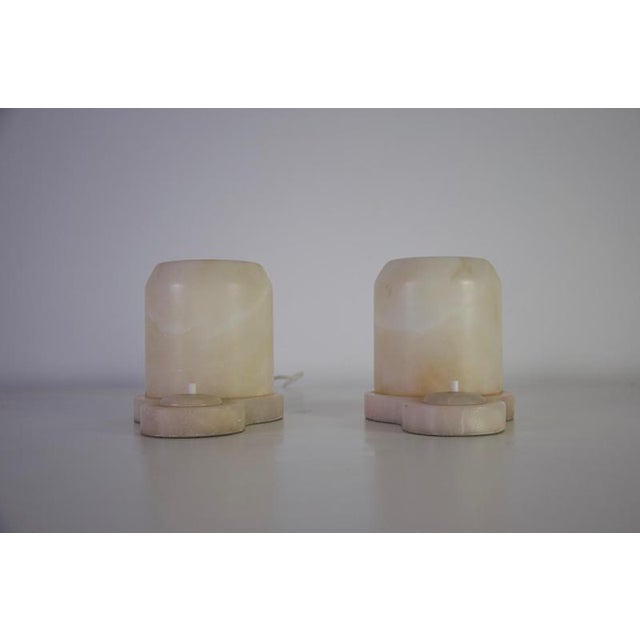 This impressive pair of large and heavy hand-carved alabaster table lamps dates to the 1930s and originates from germany....