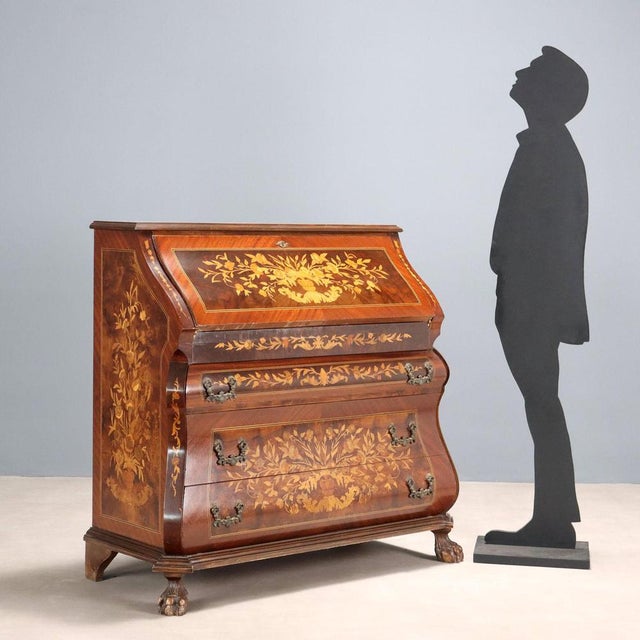 Period chest of drawers with floral and leaf inlays throughout. Curved front with three drawers, upper drop-down door...