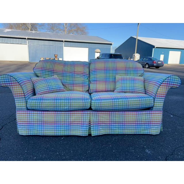 This exceptionally cheerful, custom upholstered sofa features a vibrant pastel plaid upholstery that instantly lifts the...