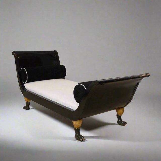Fine ebonized Austrian Empire recamiere. Ebonized wood featuring elegantly curved sides and four highly detailed carved...