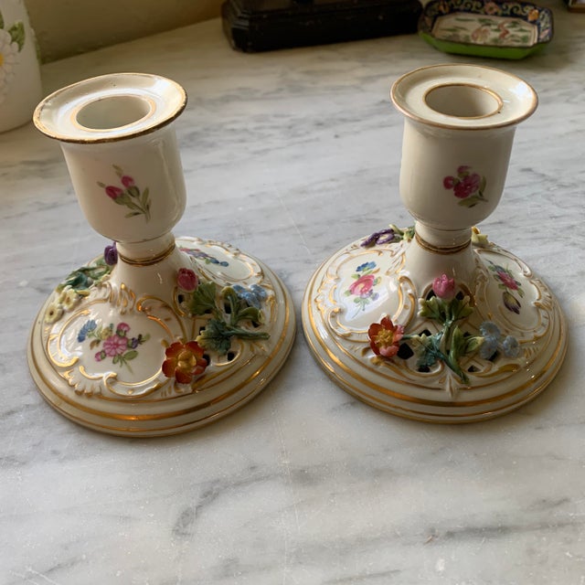 Here we have an exquisite pair of Dresden porcelain candlestick holders. Absolutely lovely hand painted florals, gilt...