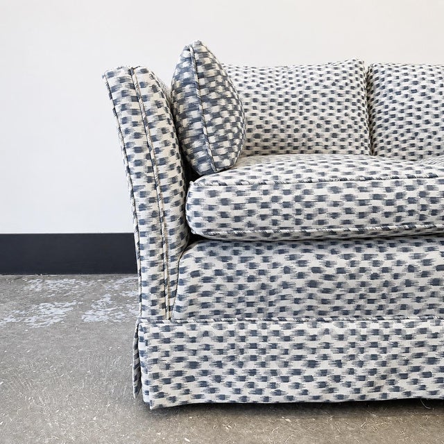 Fluted Tuxedo Sofa with Pleated Skirt. All Down Back Cushions and Down Blended Seat Cushions. Kiln-Dried Hardwood Frame....