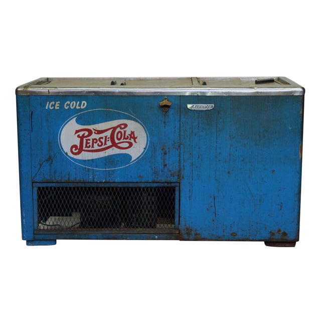 Vintage blue Pepsi Cola commercial cooler from the late 1940s to early 1950s: electric coolers, like this one, rapidly...