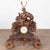 This antique Black Forest carved mantel game clock was hand-carved in Germany during the 19th century. The detailed linden...