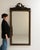 This piece presents as a mirror, distinguished by dark bronze ornate carved frame, tall. Dating to 19th Century and...