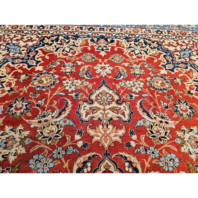 8’ 4” x 11’ 6” Vintage hand knotted Persian Isfahan room size rug from the mid 1900s. The beautiful hand-knotted rug is...