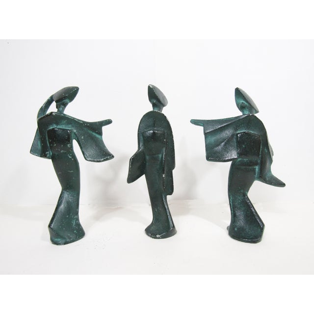 Three graphic, mid-century cast-iron figures inspired by Japan’s Awa Odori festival. The verdigris surface has time-earned...