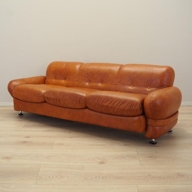 The sofa was made in the 1970s, Italian production. The sofa has retained its original upholstery. The upholstery is red...