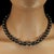 An 18‑inch green and black iridescent pearl necklace already has a striking presence, and expanding the description gives...