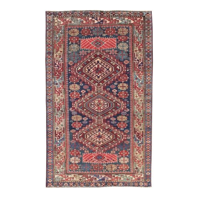Antique Kazak Tri- Medallion Rug With Multi Coors and Indigo Background For Sale