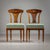 Elegant pair of Viennese chairs, the outstanding quality of the Empire chairs can be seen in the design of the backrest...
