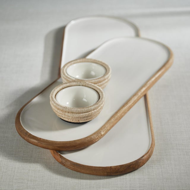 The Petrolina Mango Wood Oval Serving Tray / Platter is a beautiful and functional piece that will add a touch of warmth...