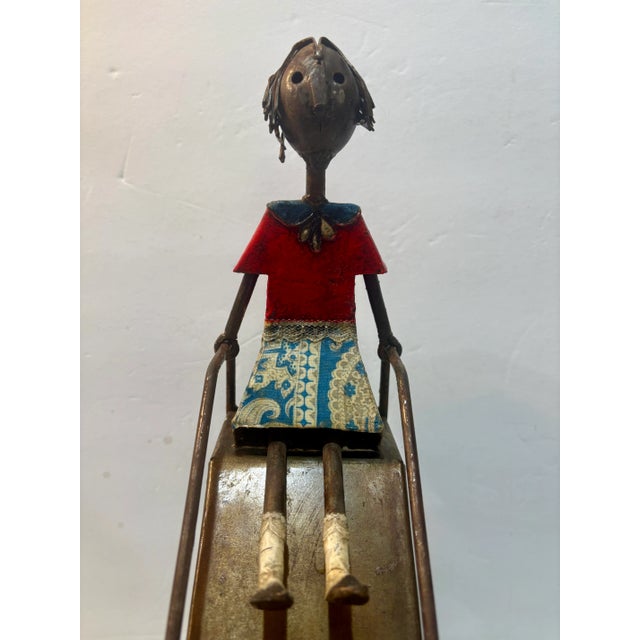 A Manuel Felguérez art sculpture of a Girl on a Slide, signed by Felguerez. The figure features painted enamel over welded...