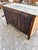 French 18th-century Louis XV bleached walnut two-door buffet, featuring beautifully carved paneled doors, elegant cabriole...