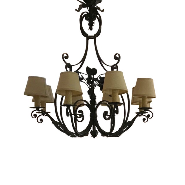 A stunning example of Paul Ferrante's celebrated artisanal craftsmanship, this hand-forged wrought-iron chandelier is a...