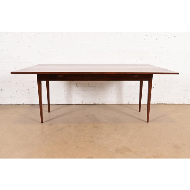 An exceptional Early American Shaker style solid cherry wood drop-leaf harvest farmhouse dining table By Eldred Wheeler...