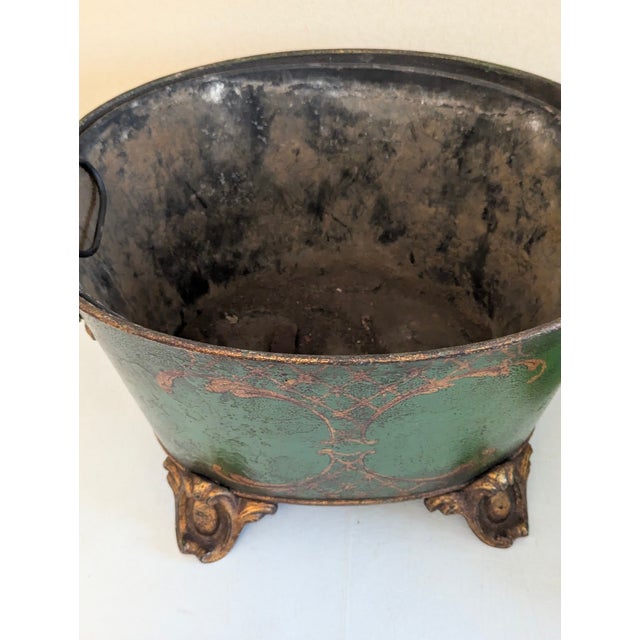 This item is a hand-painted coal scuttle originally used to carry and store coal for fireplaces. It adds a touch of class...