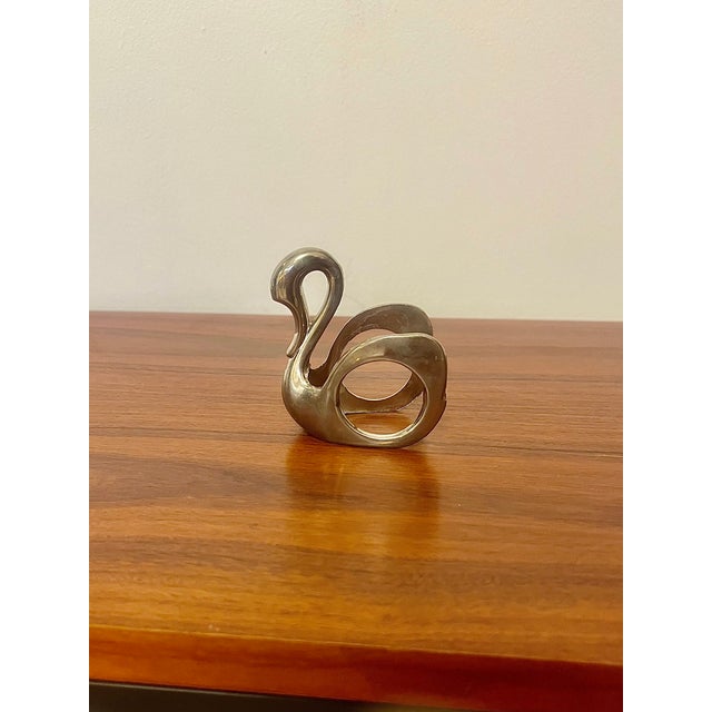 Set of four bmf swan-shaped napkin rings, crafted from silver-plated metal. with their elegantly stylized silhouette,...