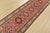 A tribal Caucasian Kazak runner hand-knotted with fine wool on a cotton foundation. This rug features a row of geometric...