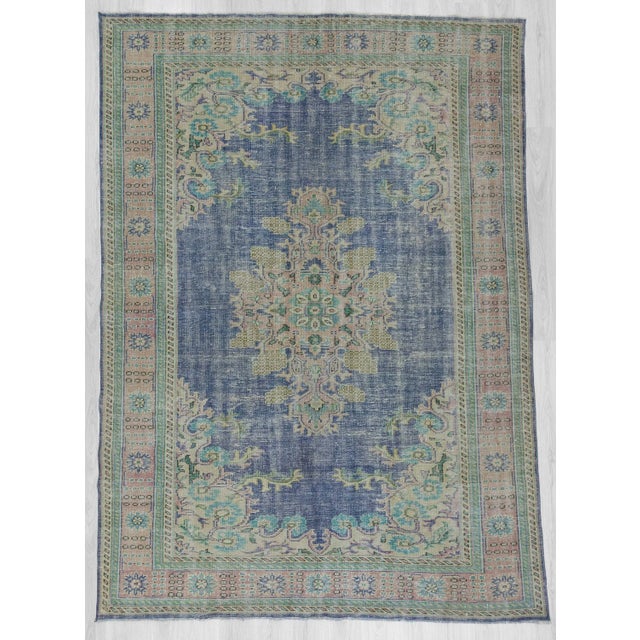 Handknotted vintage rug from Oushak region of Turkey. Approximately 50-60 years old. In very good condition.