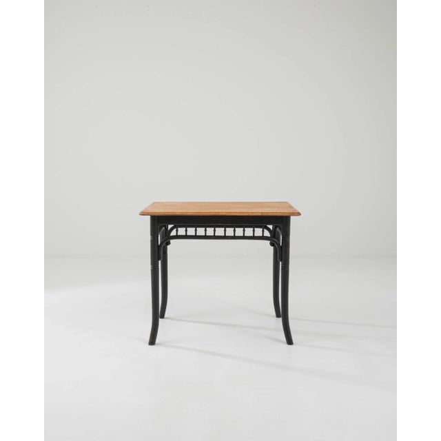A wooden side table created in early 20th century Austria, in the style of Thonet. At first simple and unassuming, this...