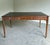 Exceptional Theodore Alexander ‘Man of Letters’ partners writing desk crafted in richly figured flame mahogany veneers...