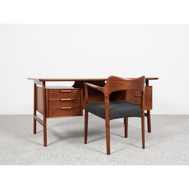 This desk is designed and manufactured by Omann Jun in Denmark in the 1960s. The design is known as Model 75. It is a good...
