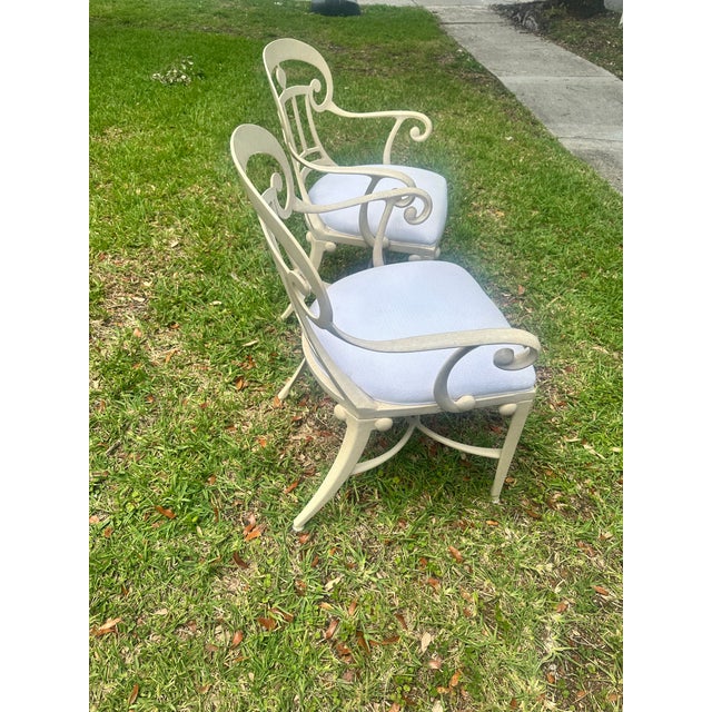 Elegant pair of vintage cast aluminum armchairs in the style of Veneman, featuring beautifully sculpted openwork backs,...