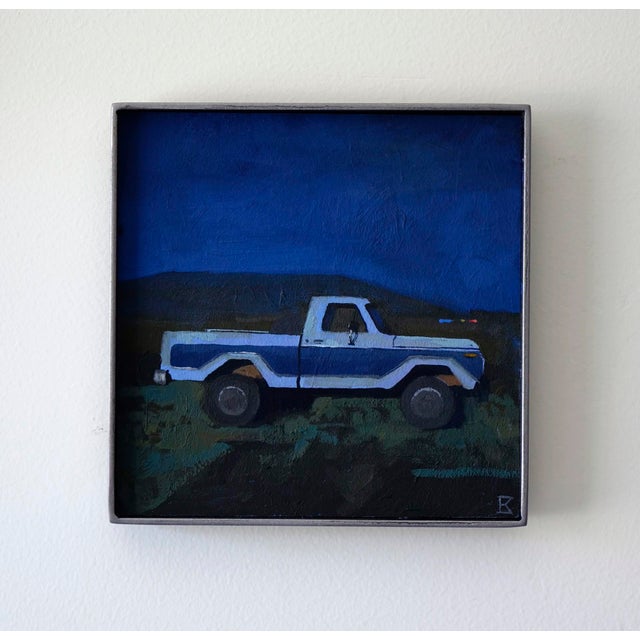 In "Moonlight," a vintage truck stands against a deep blue night sky, evoking a sense of nostalgia and solitude. The bold...