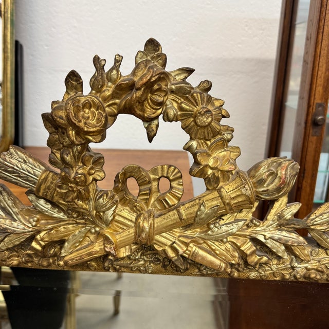 This exquisite 19th-century French mirror beautifully captures the elegance of the Louis XVI style. Crafted from giltwood...