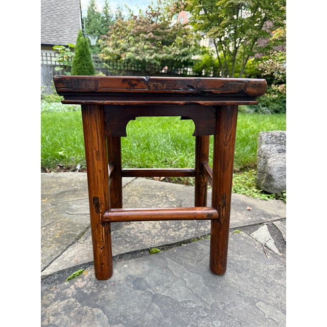 Lovely antique provincial Chinese hardwood low stool / table, circa early 20th century. This stool is crafted from solid...