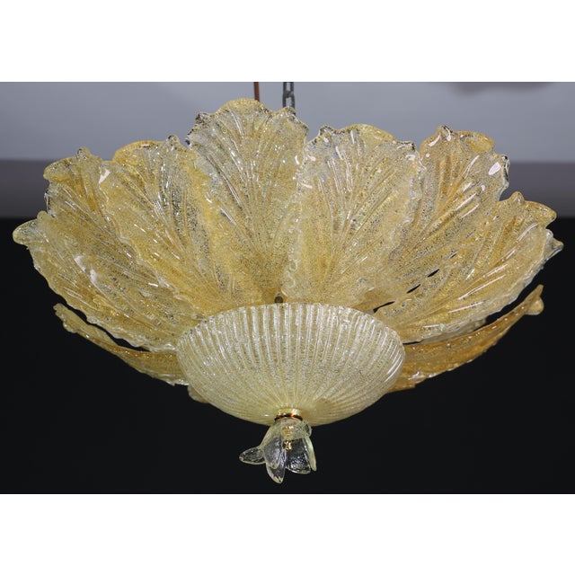 Splendid Murano glass ceiling lamp, the leaves are all the same gold color. Period: circa 1970. The light mounts 6...
