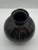Vintage Haeger black orb vase with white markings on upper half. Stamped on bottom and with original tag.
