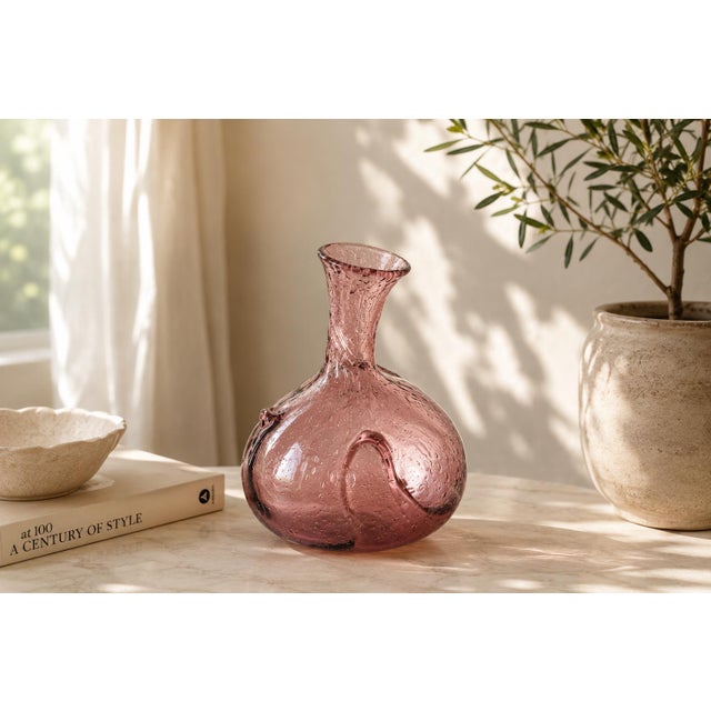 Hand-blown art-glass vase dating to the 1990s, in a soft amethyst-mauve colour. Bullicante-style bubble inclusions run...