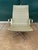 Vintage Herman Miller aluminum frame high back lounge chair with gold/brass tone arms and green vinyl upholstery designed...