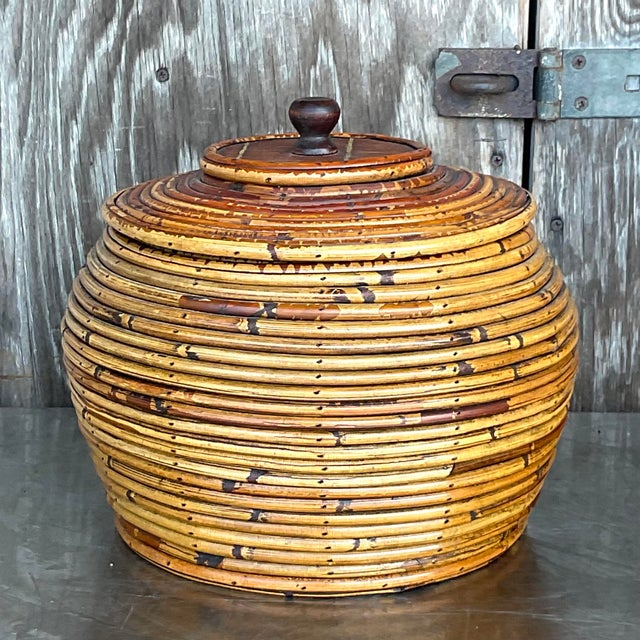 A fabulous vintage Coastal lidded urn. A chic coiled pencil reed in warm brown tone. Coordinating tall urn also available...