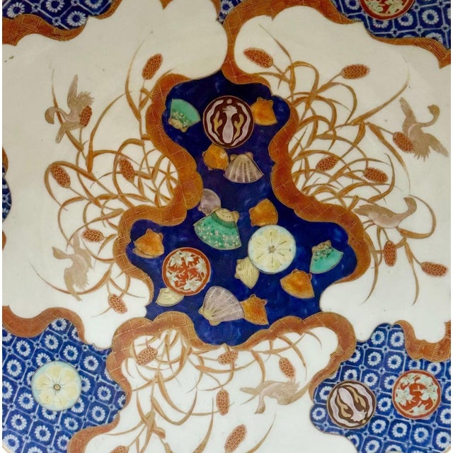 A striking example of 18th century Japanese craftsmanship, this Imari charger is a masterpiece of color, form, and...