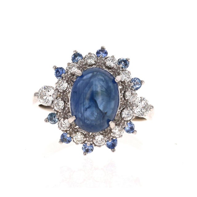 Roshe Jewels Sapphire Ring with Diamonds White Gold Cocktail Ring, 5.20 Carats This ring has a Cabochon Blue Sapphire that...