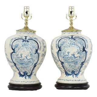 Pair of Vintage Hand Painted Blue and Cream Ceramic Table Lamps With Deer and Floral Folk Art Design For Sale